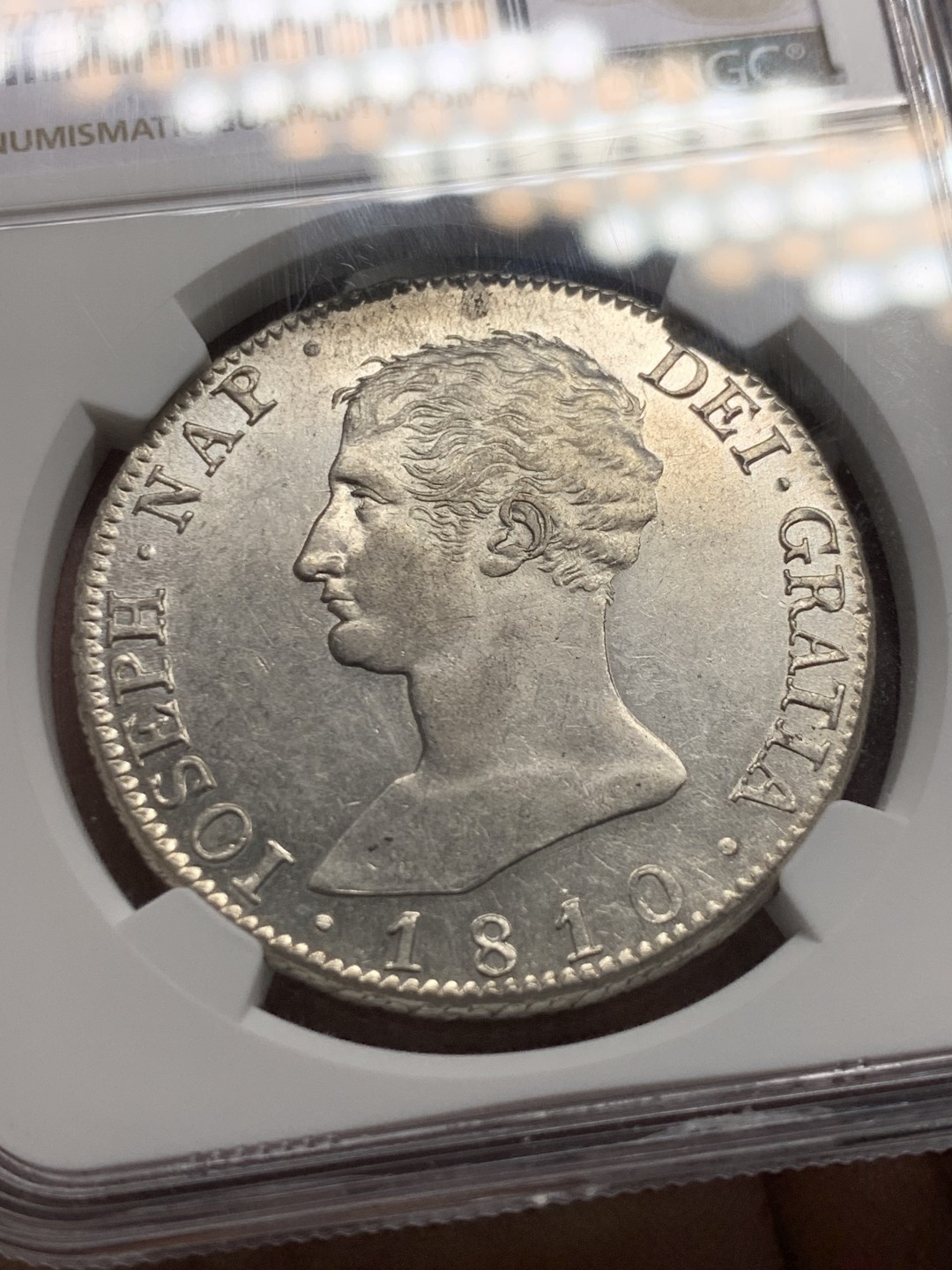 《竞宝斋》第147场-周日，周一 2场 (全场包邮) NGC AU58 1810年 法占西班牙 约瑟夫拿破仑20R银币，细节极佳 发丝清晰 光感十足 低评了