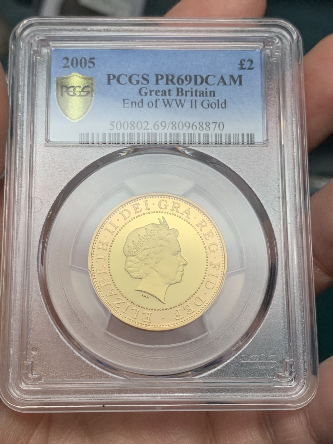 《竞宝斋》第147场-周日，周一 2场 (全场包邮) PCGS PR69DCAM 2005年 英国二战结束60年纪念金币 15.976克 0.9167金 直径28.4MM  发行2，924枚