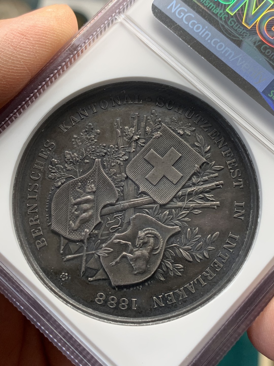 《竞宝斋》第148场-周日，周一 2场 (全场包邮) NGC-MS61 瑞士1888年 狩猎节大银章 背面三徽 系列里的难点