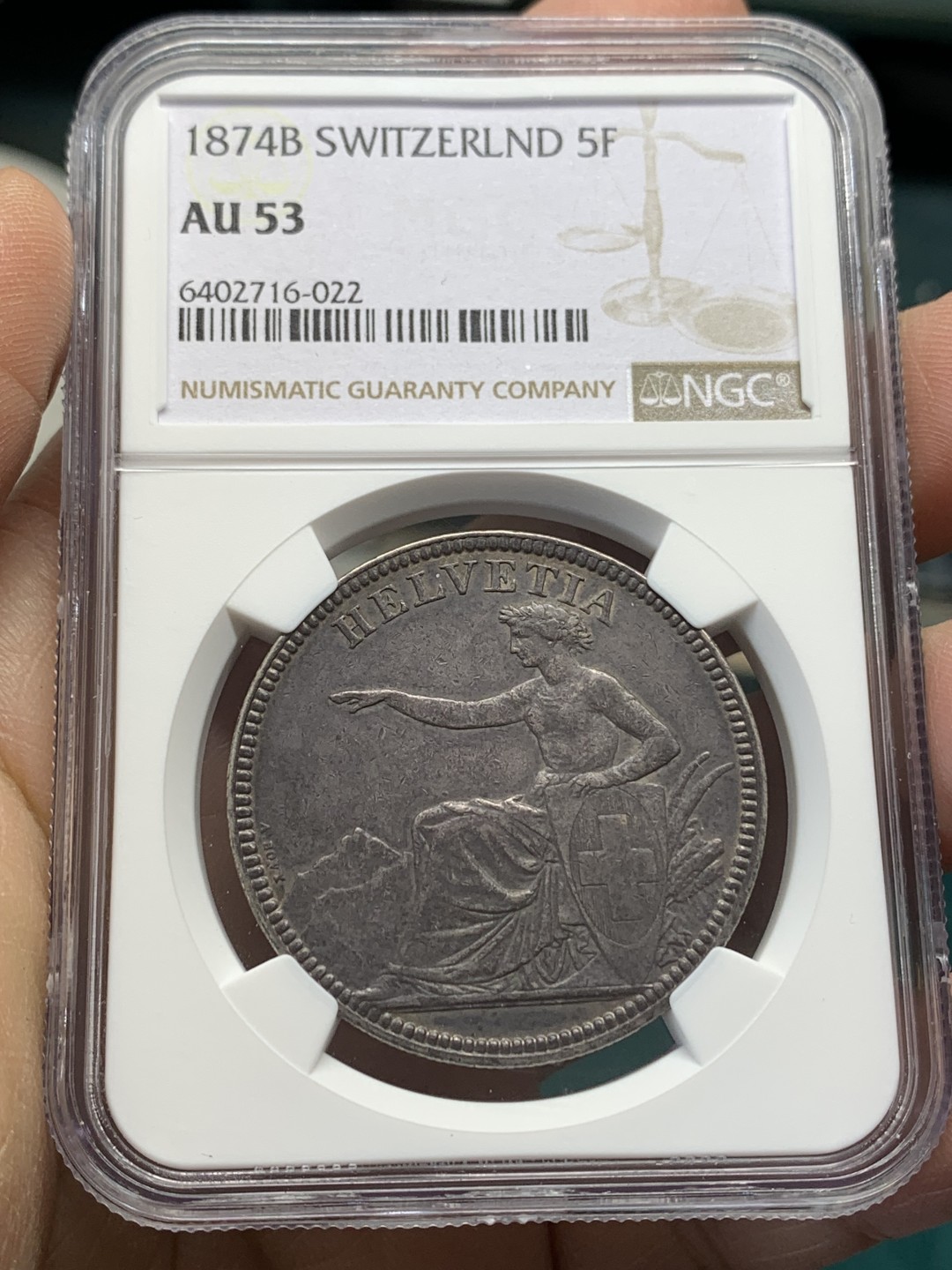 《竞宝斋》第148场-周日，周一 2场 (全场包邮) NGC AU53 瑞士 1874年B版 坐人女神 5法郎 大银币 正反均匀的深黑包浆 细节好 少见品种