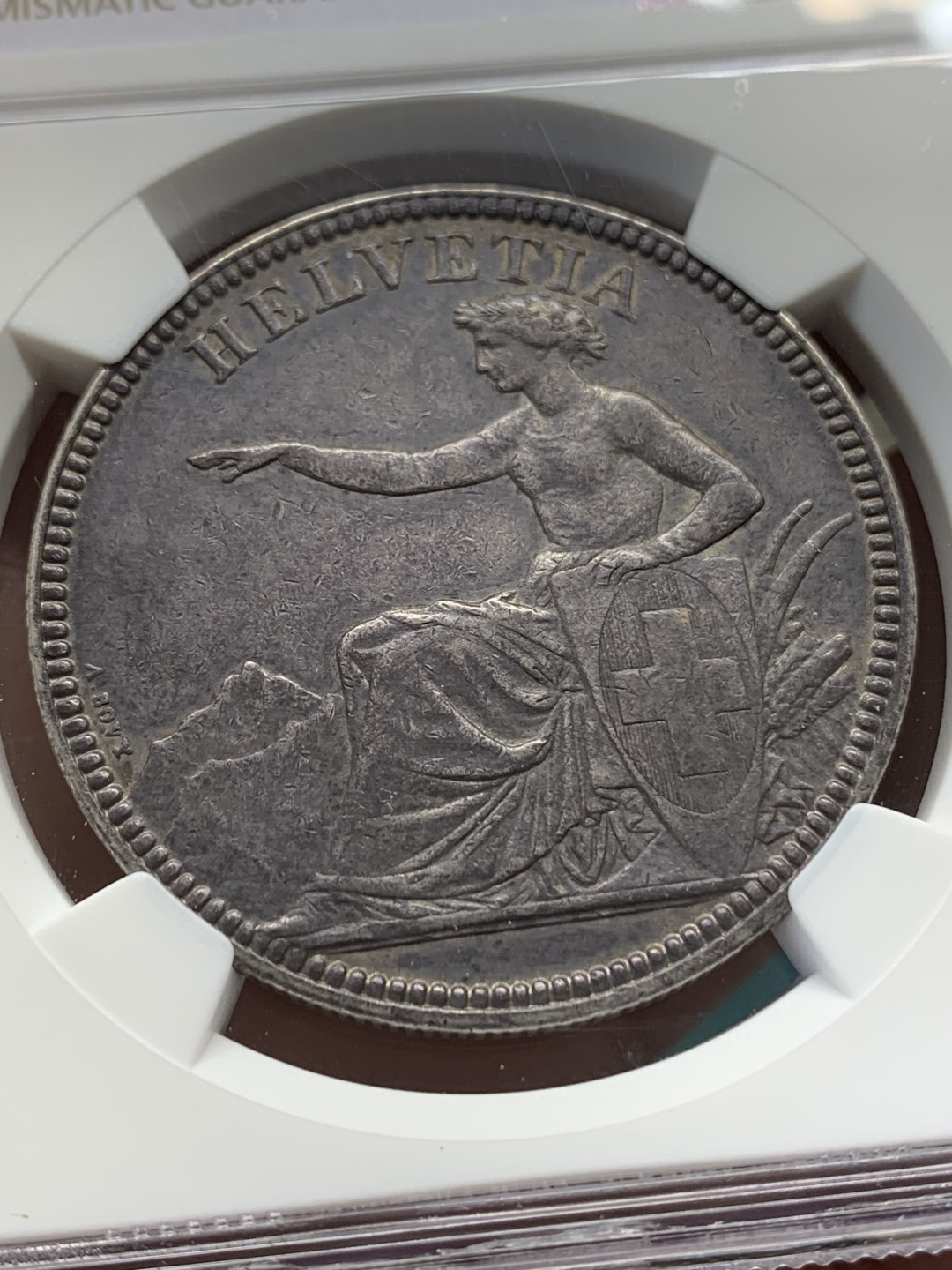 《竞宝斋》第148场-周日，周一 2场 (全场包邮) NGC AU53 瑞士 1874年B版 坐人女神 5法郎 大银币 正反均匀的深黑包浆 细节好 少见品种