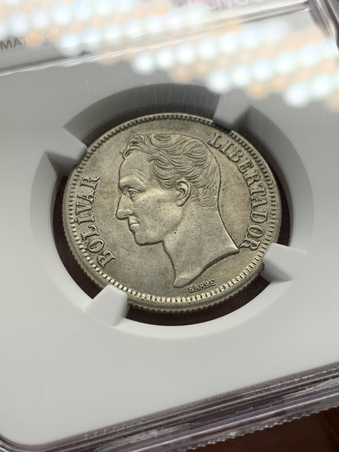 《竞宝斋》第148场-周日，周一 2场 (全场包邮) NGC-AU58 委内瑞拉1945年 2玻利瓦尔银币 这个面值好品更加少见