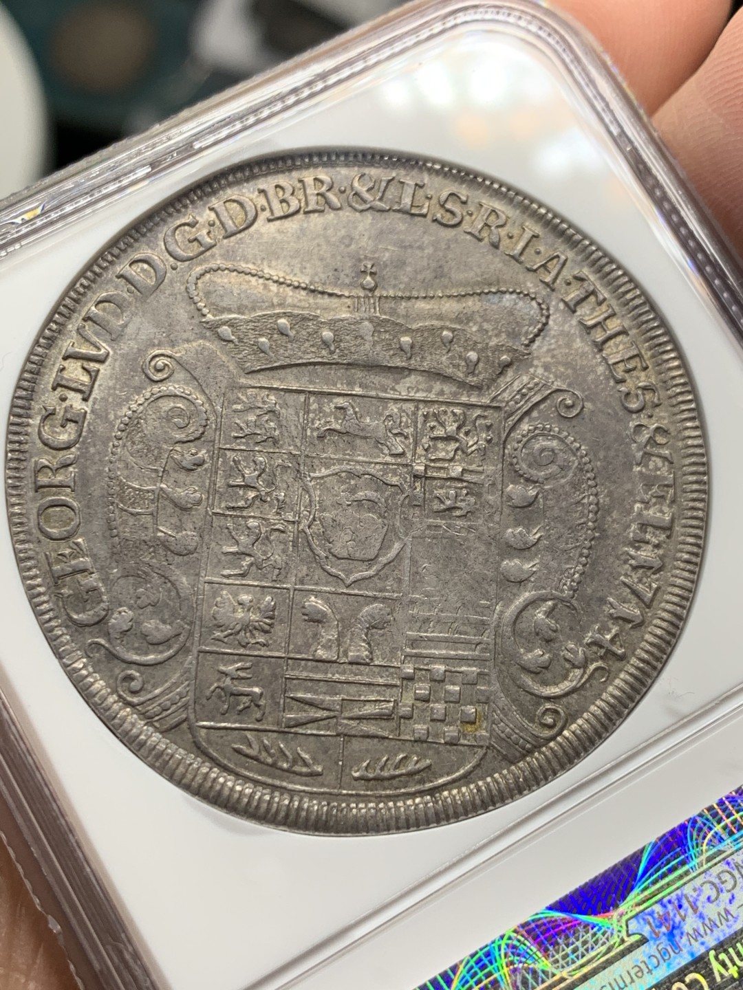 《竞宝斋》第148场-周日，周一 2场 (全场包邮) 唯一冠军分 NGC MS62 德国 布伦瑞克1714年 野人 泰勒大银币 脸部清晰 草裙飞扬 深彩包浆 一枚便是全部