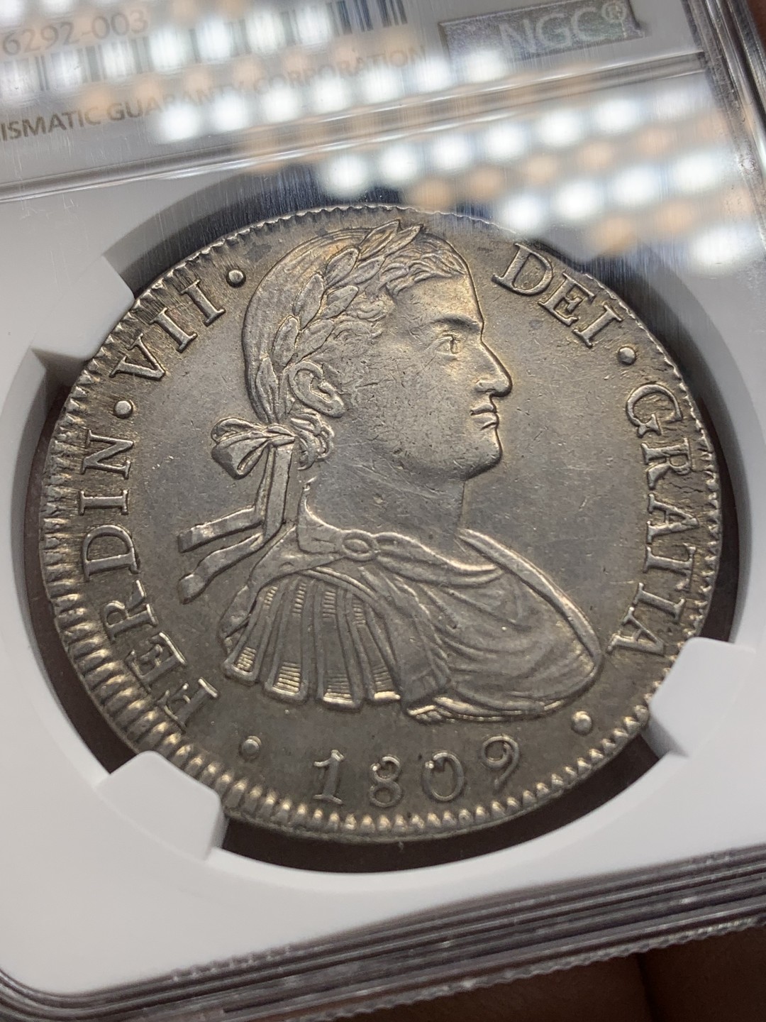 《竞宝斋》第148场-周日，周一 2场 (全场包邮) NGC AU55 墨西哥 1809年 费七戎装版 8R 双柱大银币 打制极好 可藏