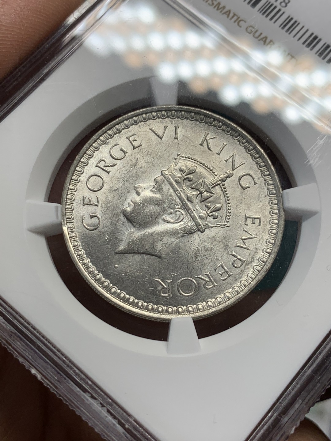 《竞宝斋》第148场-周日，周一 2场 (全场包邮) NGC MS62 英属印度 1944年B版 乔治六世1卢比银币 reverseB版 背面精雕花纹 细节很清晰 少见版本 原光好品