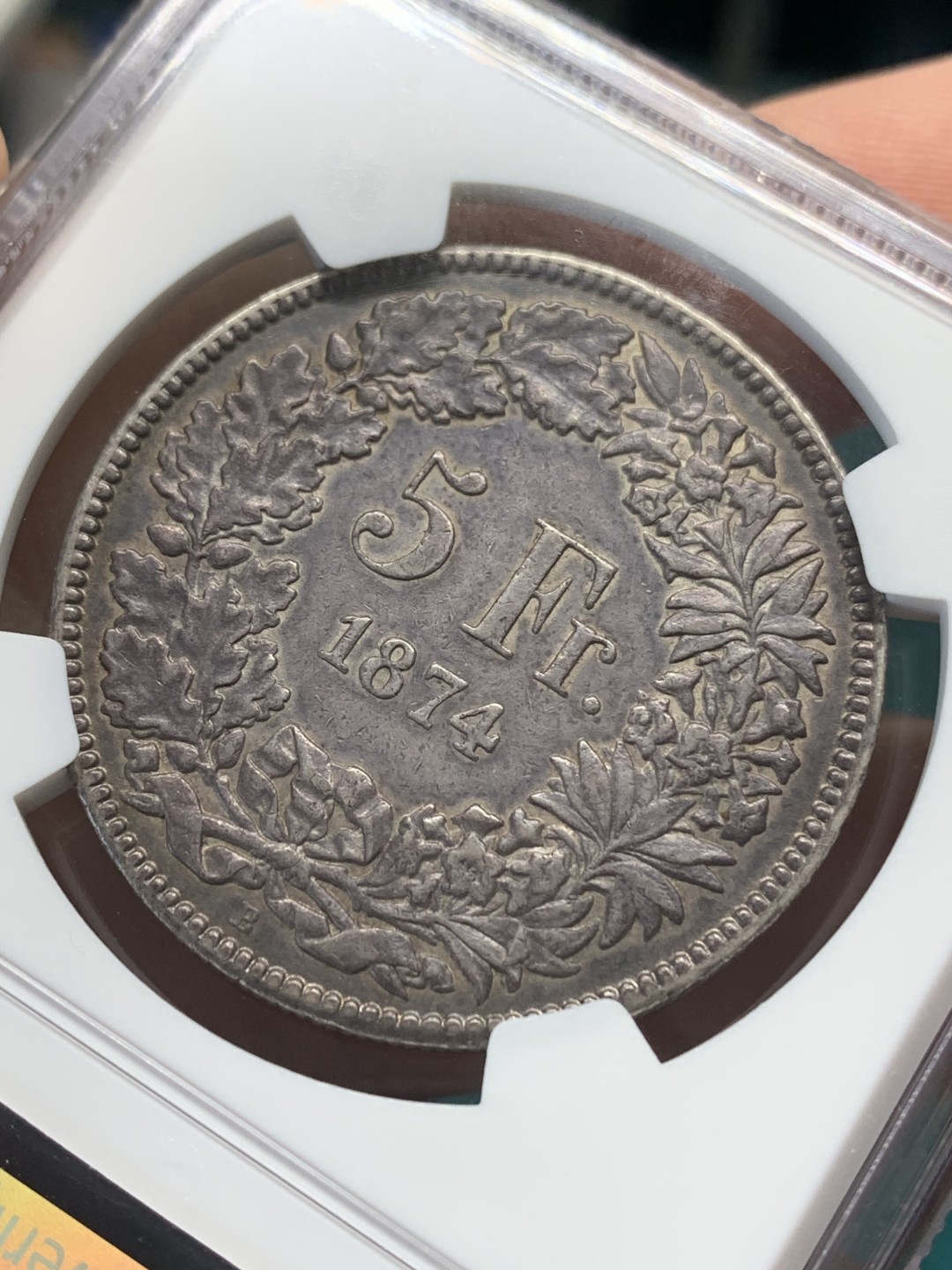 《竞宝斋》第148场-周日，周一 2场 (全场包邮) NGC AU53 瑞士 1874年B版 坐人女神 5法郎 大银币 正反均匀的深黑包浆 细节好 少见品种