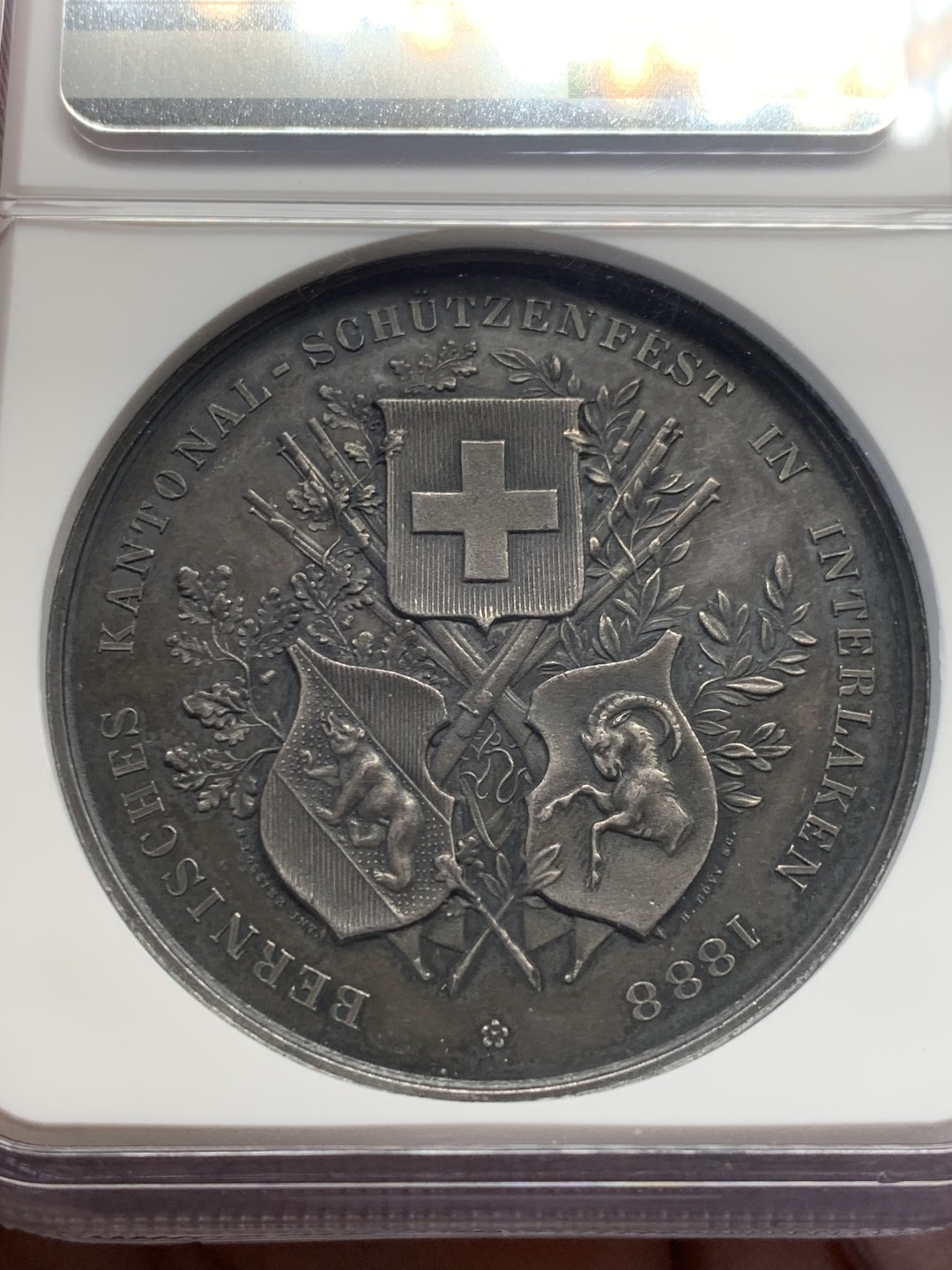 《竞宝斋》第148场-周日，周一 2场 (全场包邮) NGC-MS61 瑞士1888年 狩猎节大银章 背面三徽 系列里的难点