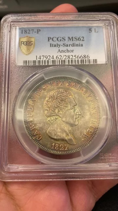 万国钱币拍卖第005期 意大利萨丁王国1827年P厂5里拉，亚军分，包浆绚丽，底板整洁，pcgs封面币，克劳斯目录ms60价格为1550美金