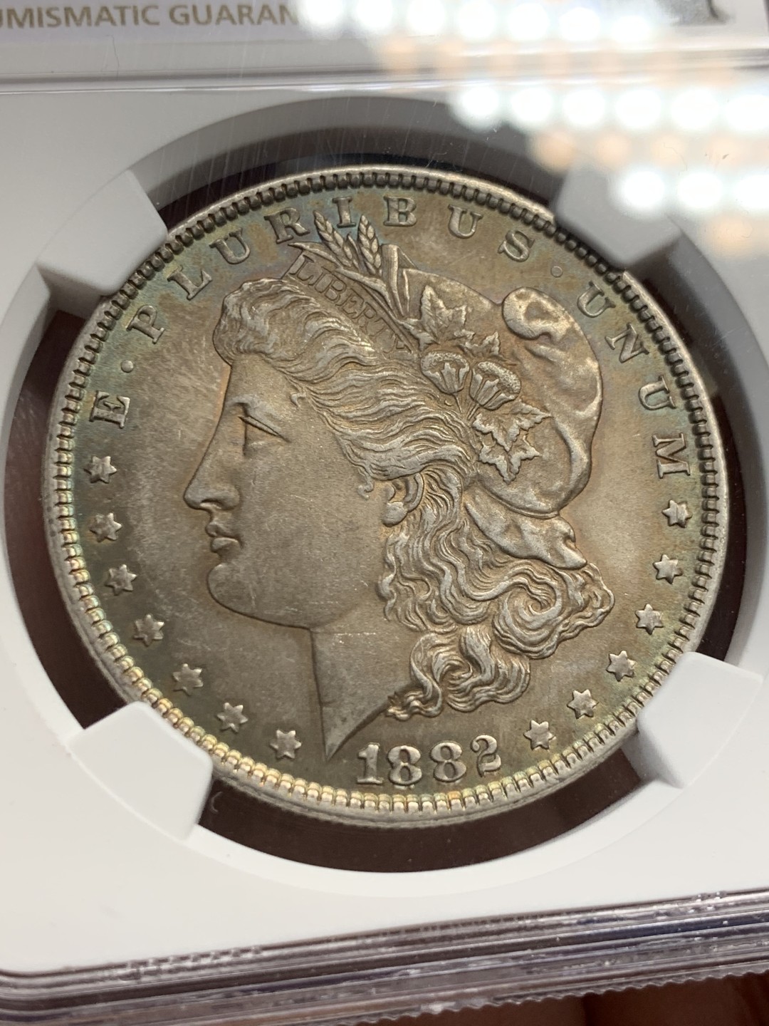 《竞宝斋》第149场-周日，周一，周四 3场 (全场包邮) NGC-MS63 美国1882年 摩根一元 五彩包浆