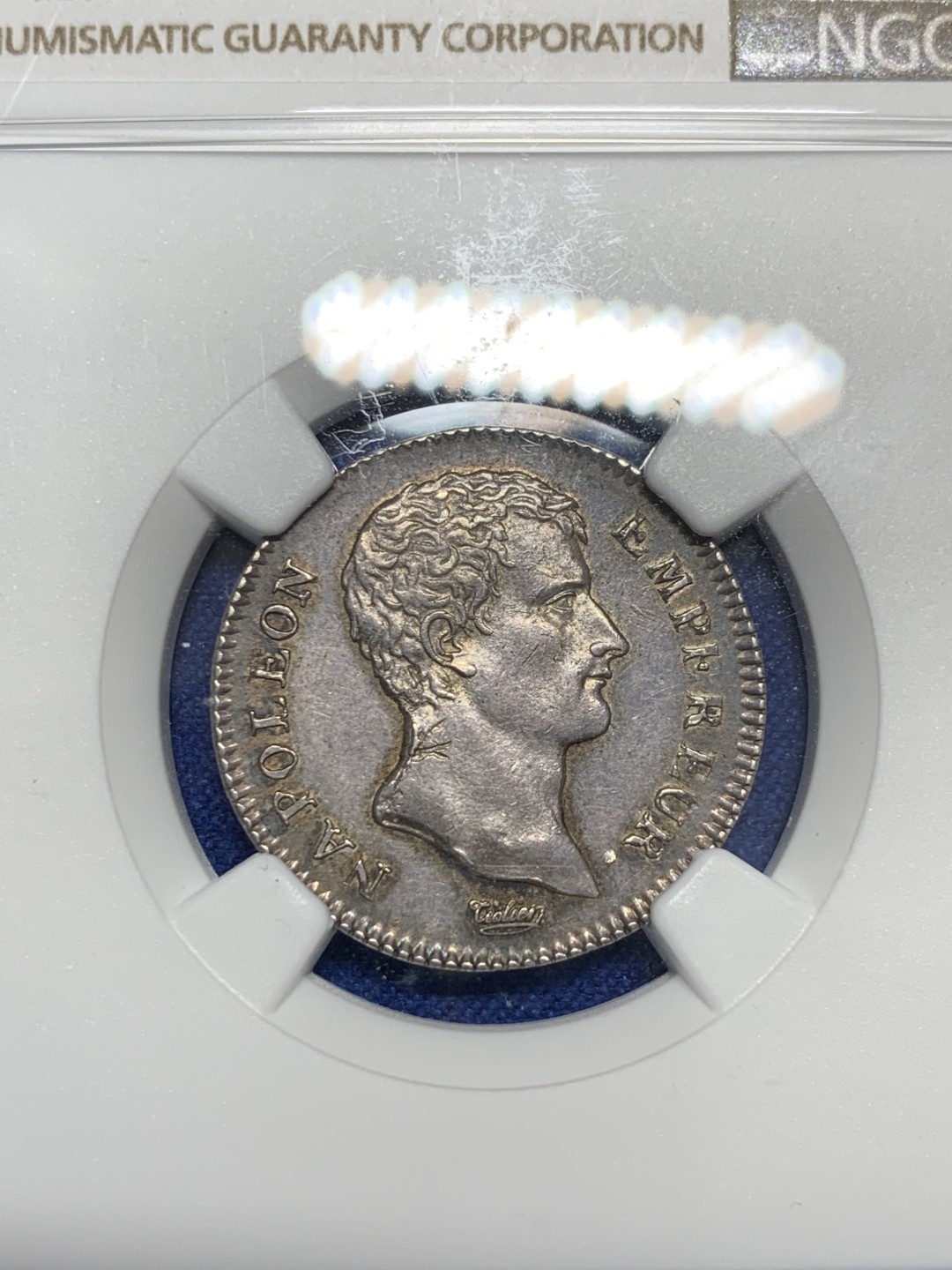 《竞宝斋》第150场-周日，周一，周四 3场 (全场包邮) NGC-AU55 共和13年 拿破仑第一执政1法郎银币 执政官头像少见 发丝细节上佳，黑彩老包浆。1法郎流通充分，书价比常见年份的5法郎更高