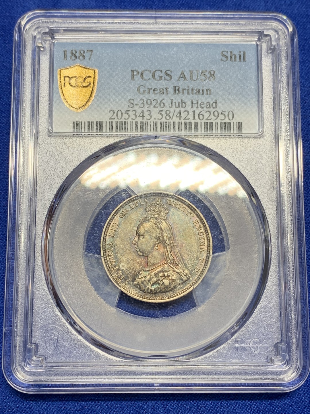 《竞宝斋》第150场-周日，周一，周四 3场 (全场包邮) PCGS AU58 英国 1887 维多利亚女王 1先令银币 蓝绿包浆 状态好 包浆影响了分数挡住了光芒