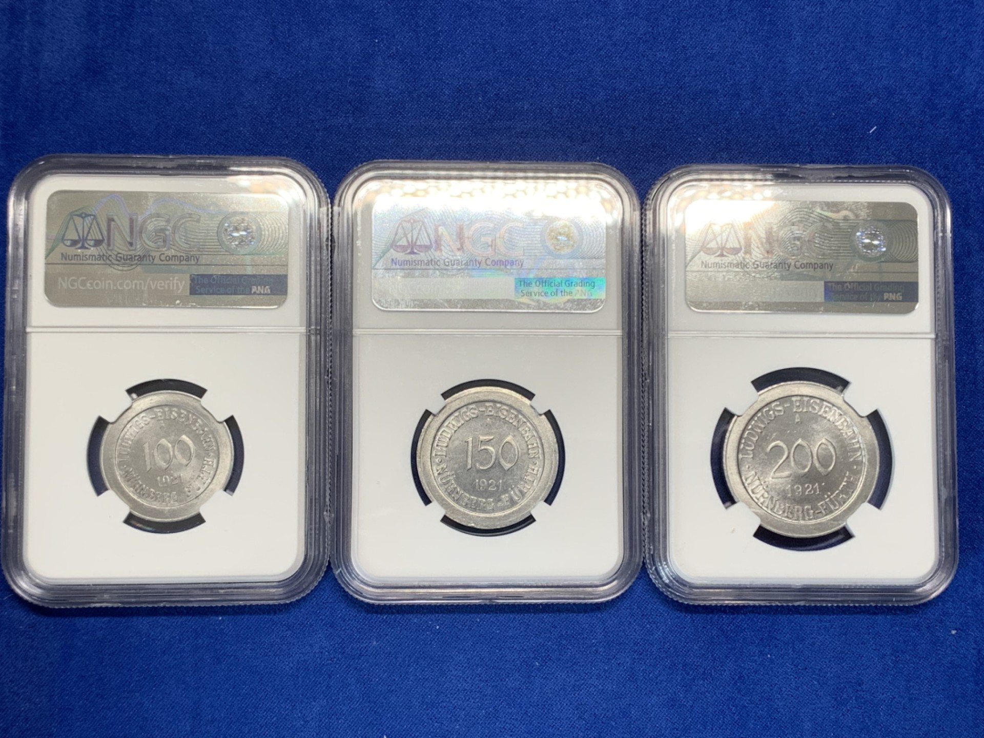 《竞宝斋》第150场-周日，周一，周四 3场 (全场包邮) NGC-MS62-64一套 德国1921年紧急状态货币纽伦堡电车铝币三枚一套，镜面底板，题材刻画生动鲜明