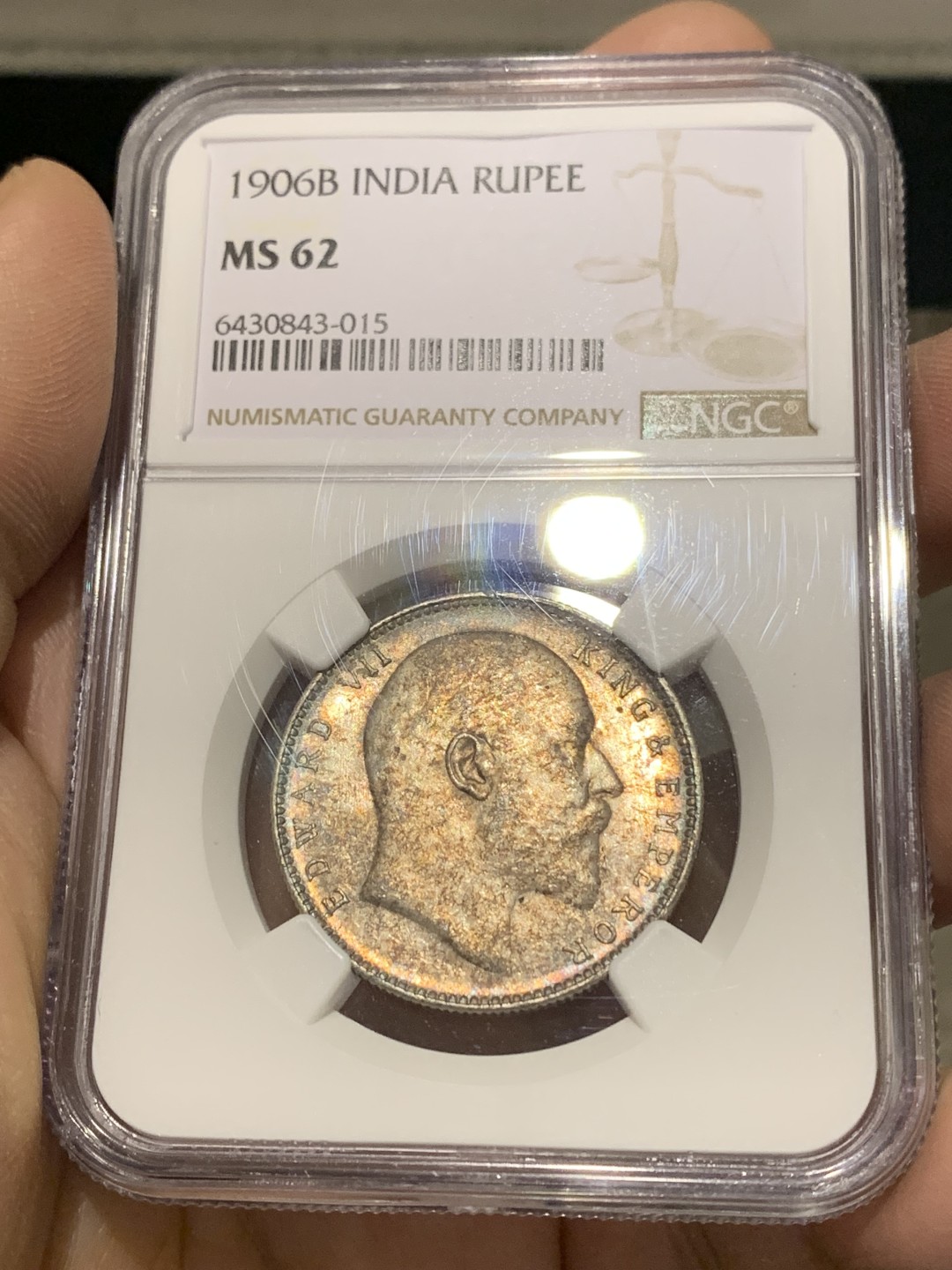 《竞宝斋》第150场-周日，周一，周四 3场 (全场包邮) NGC MS62 英属印度 爱七1卢比银币 1906较少年份，评级数量少，五彩包浆难得。曝光下地板丝滑