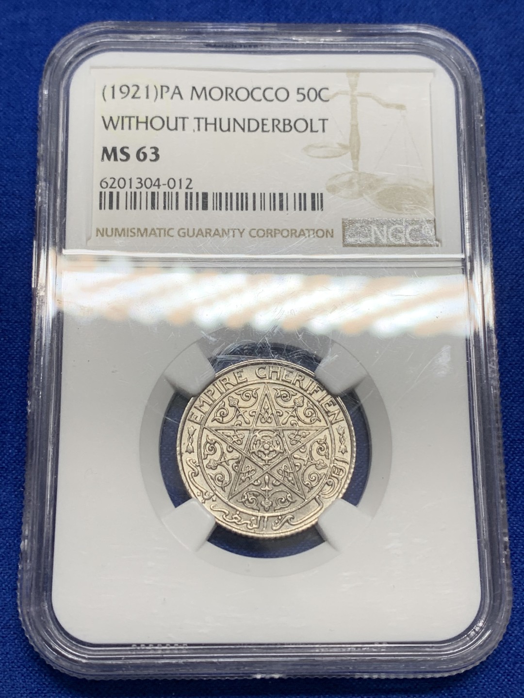 《竞宝斋》第150场-周日，周一，周四 3场 (全场包邮) NGC-MS63 亚军分 1921年 摩洛哥50分，1/2法郎。单年版，五芒星繁复华丽。MS以上少见，63分参考价100美刀