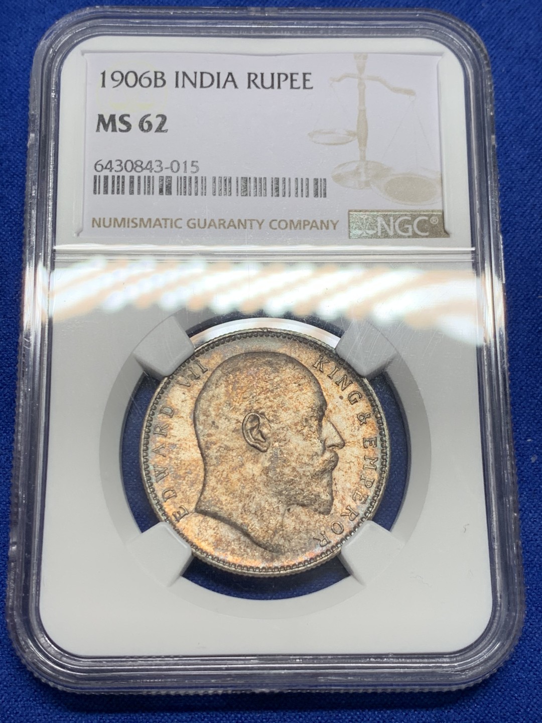 《竞宝斋》第150场-周日，周一，周四 3场 (全场包邮) NGC MS62 英属印度 爱七1卢比银币 1906较少年份，评级数量少，五彩包浆难得。曝光下地板丝滑