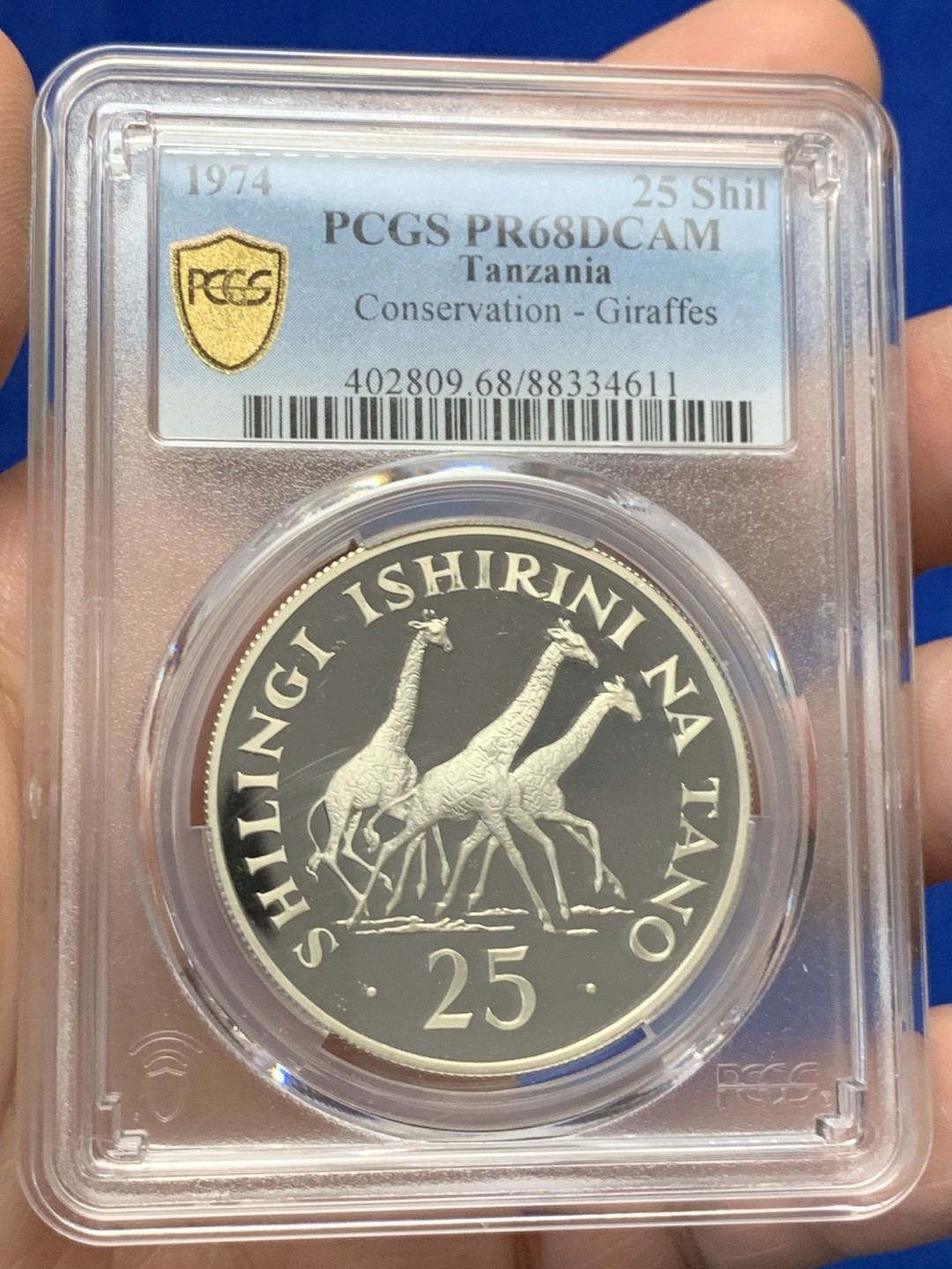 《竞宝斋》三少爷老婆本专场-第156场 (全场包邮) PCGS金盾 PR68DCAM 坦桑尼亚1974年长颈鹿25先令精制银币