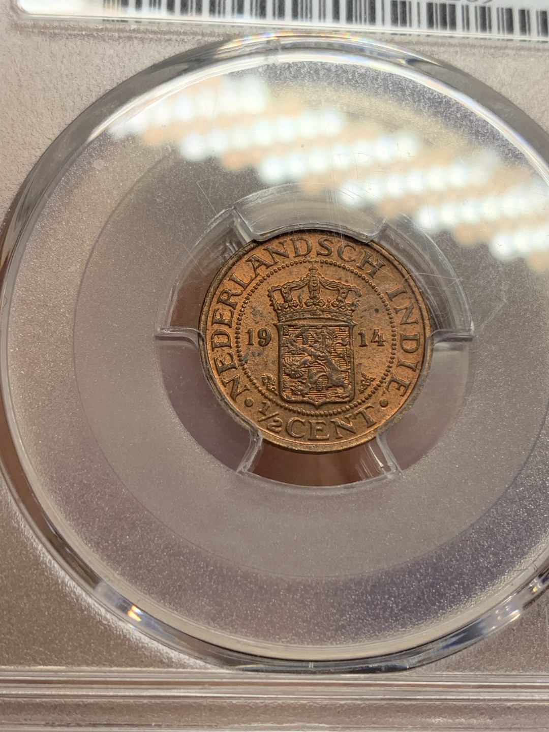 《竞宝斋》第159场-周日，周一 2场 (全场包邮) PCGS-MS64RD 唯一冠军分 1914年 荷属东印度1/2C铜币，RD冠军品质，红铜光靓丽。不是后期常见的194x版，较早年份的荷属东印度都少见