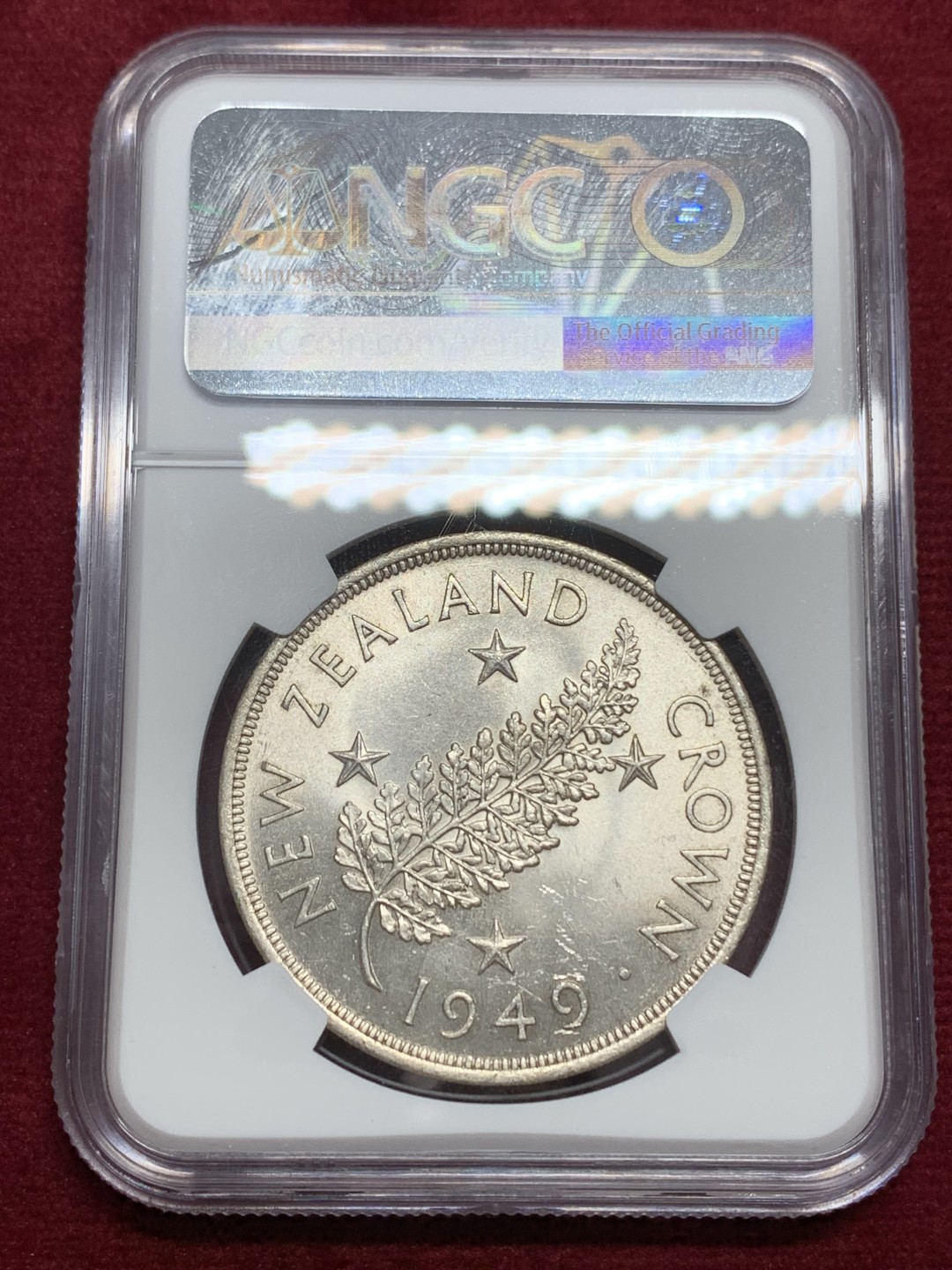 《竞宝斋》第159场-周日，周一 2场 (全场包邮) NGC MS63 新西兰 1949 乔六克朗大银币，背面新西兰国花银蕨，全转光品相