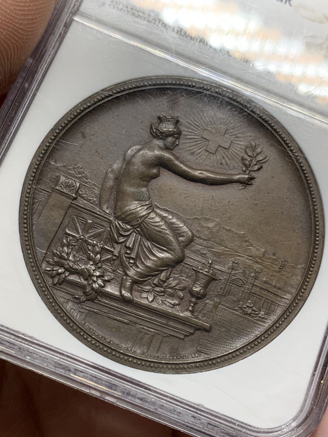 《竞宝斋》第159场-周日，周一 2场 (全场包邮) NGC-MS62 1895年 瑞士温图尔特射击节铜章 45mm满盒大铜，手感厚重。刻画精美的拿花女神