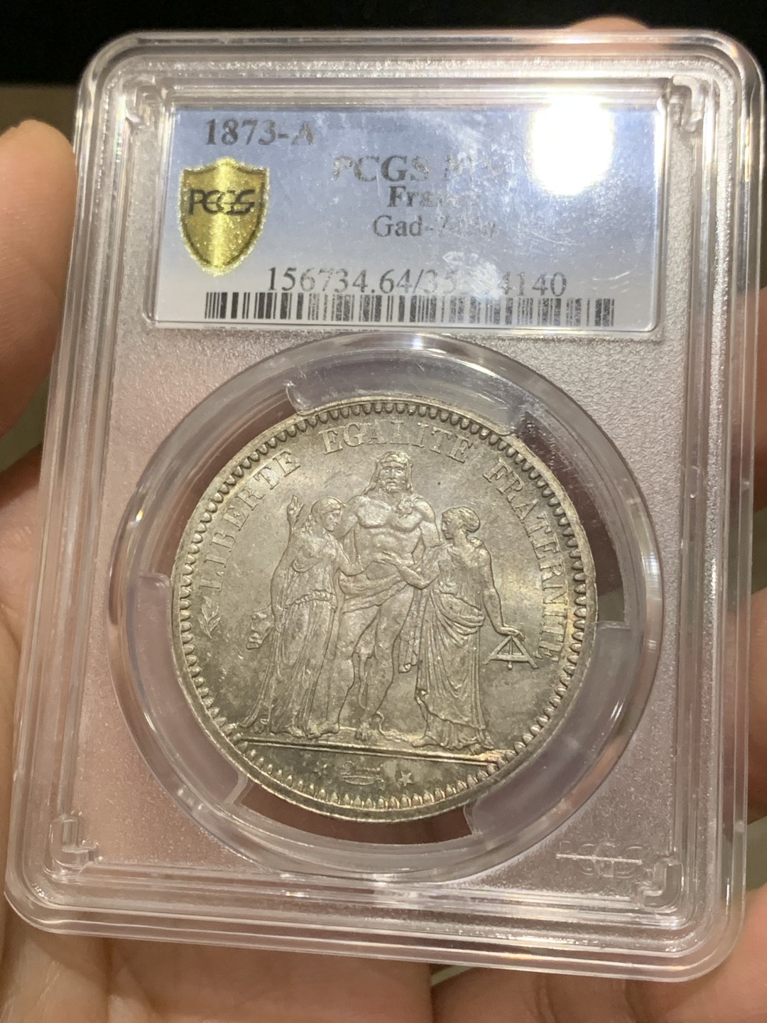 《竞宝斋》第159场-周日，周一 2场 (全场包邮) PCGS-MS64 法国 1873 大力神5法郎大银币。转光流畅的一颗，底板丝滑。老欧洲包浆，背面绚彩，盒子背面小磕