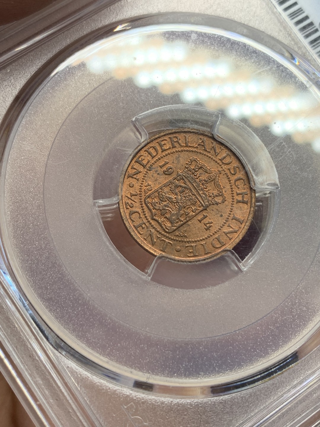 《竞宝斋》第159场-周日，周一 2场 (全场包邮) PCGS-MS64RD 唯一冠军分 1914年 荷属东印度1/2C铜币，RD冠军品质，红铜光靓丽。不是后期常见的194x版，较早年份的荷属东印度都少见