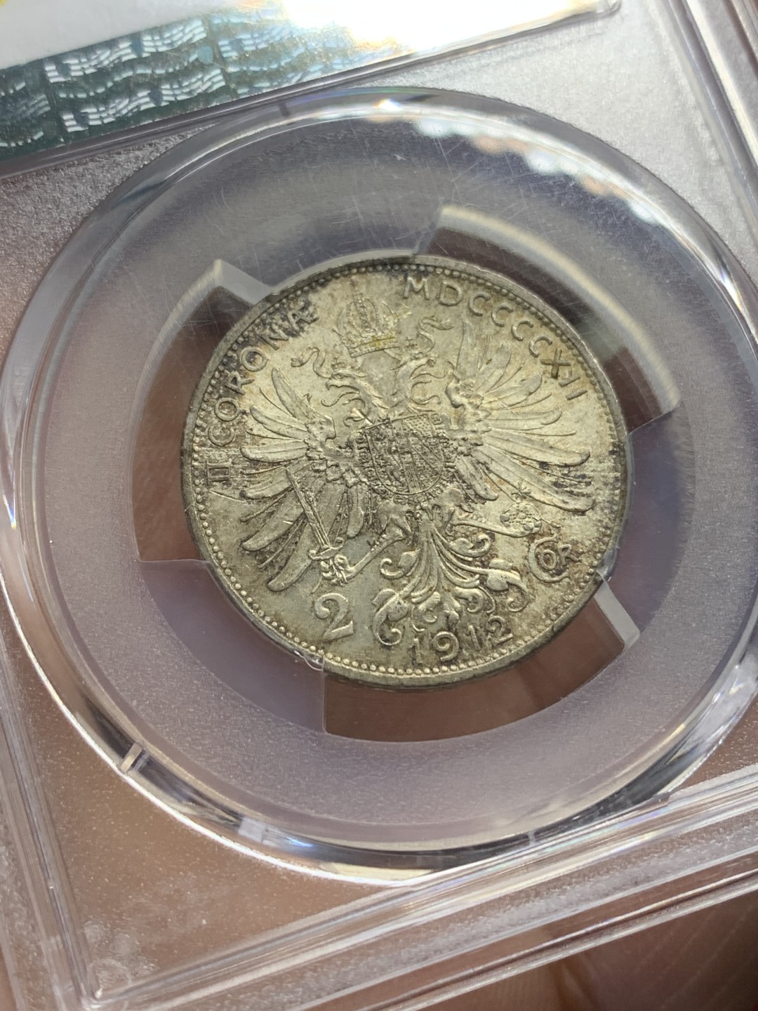 《竞宝斋》第159场-周日，周一 2场 (全场包邮) PCGS-MS64 1912年奥匈帝国2克朗奥地利版 这套银币里只有1克朗好品常见，MSd的2克朗和5克朗都少见，这枚黄油包浆带光，状态不错