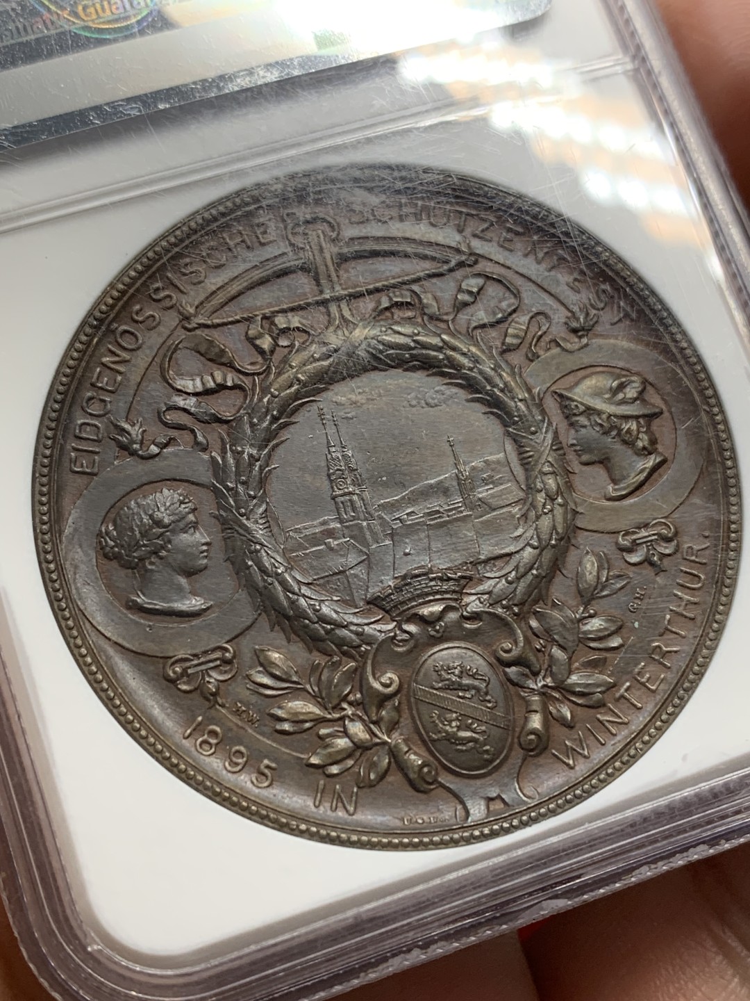 《竞宝斋》第159场-周日，周一 2场 (全场包邮) NGC-MS62 1895年 瑞士温图尔特射击节铜章 45mm满盒大铜，手感厚重。刻画精美的拿花女神