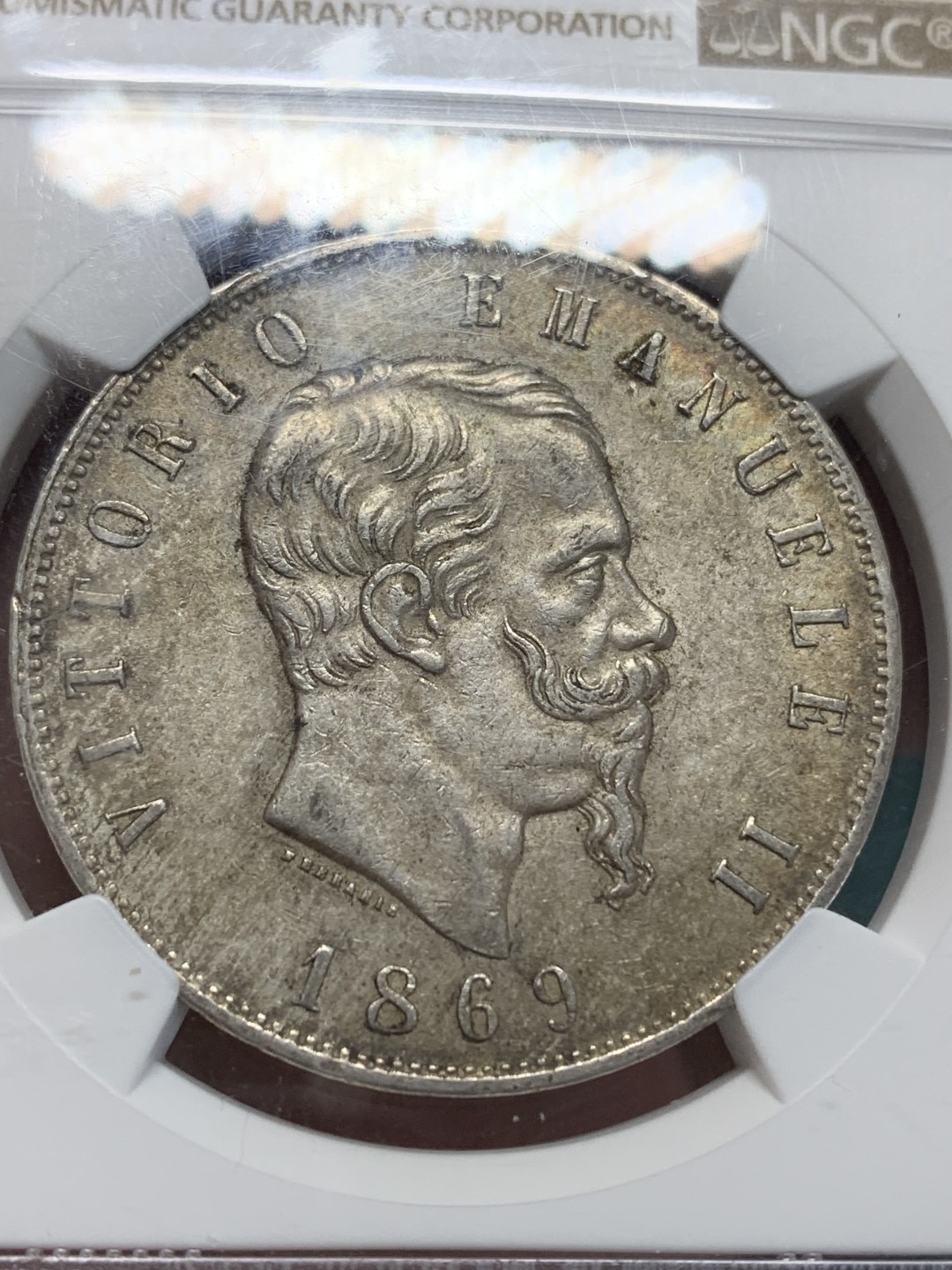 《竞宝斋》第159场-周日，周一 2场 (全场包邮) NGC-MS62 意大利5里拉大银 1869年该品种首年 枪灰色泛橙包浆 意大利国父埃马努埃尔二世早期统治意大利的见证