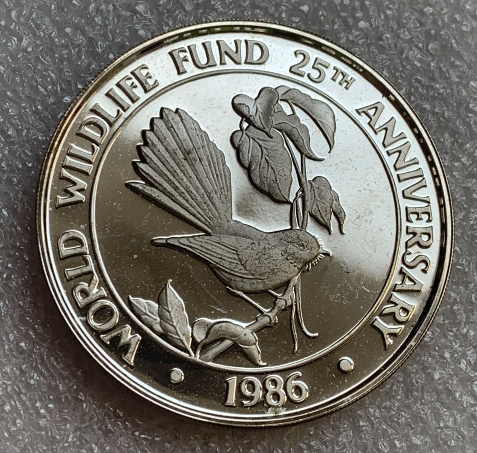 瓶子🏺第89期拍卖会 萨摩亚1986年野生动物基金会系列报喜鸟1盎司银币