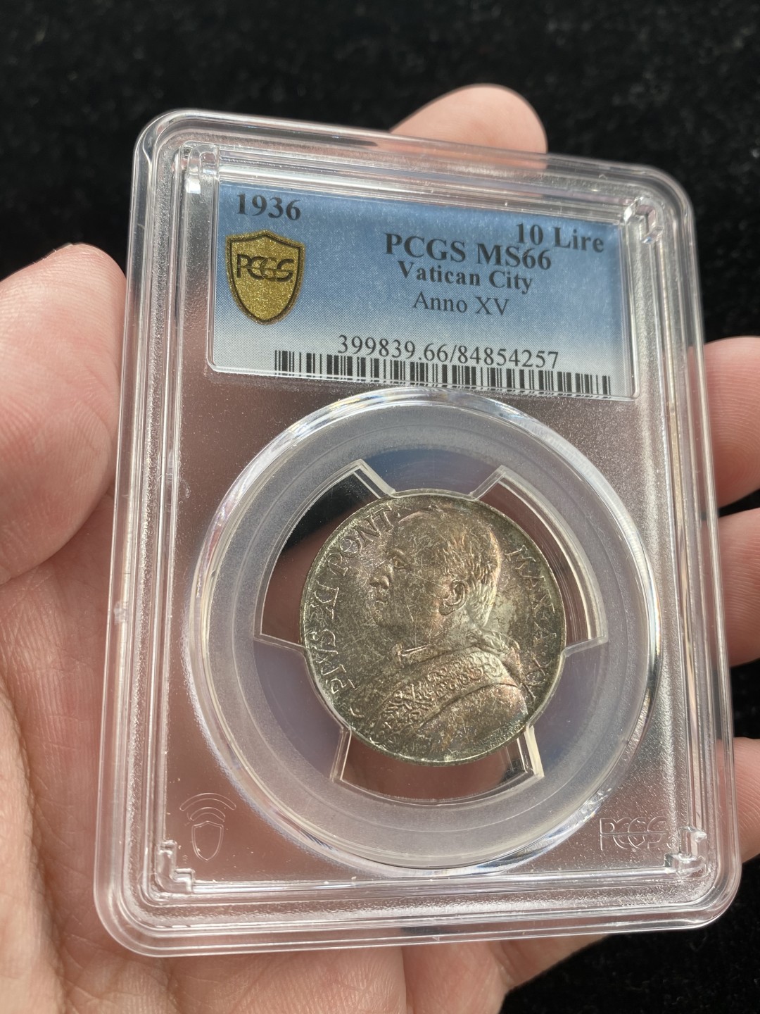 万国钱币拍卖第007期（慕尼黑第二夜） PCGS-MS66 梵蒂冈1936年圣母抱婴10里拉，PCGS亚军分，更高分仅一枚，顶级品相，双面五彩难掩底板光亮。