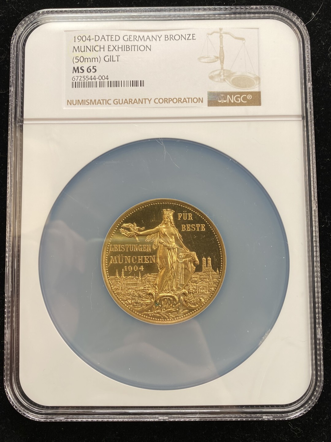 万国钱币拍卖第007期（慕尼黑第二夜） NGC MS65 1904年德国慕尼黑颁发的中央发明家日耳曼尼娅荣誉纪念镀金大铜章，一面日耳曼尼娅女神一面城市女神，唯一冠军分，50MM 59G