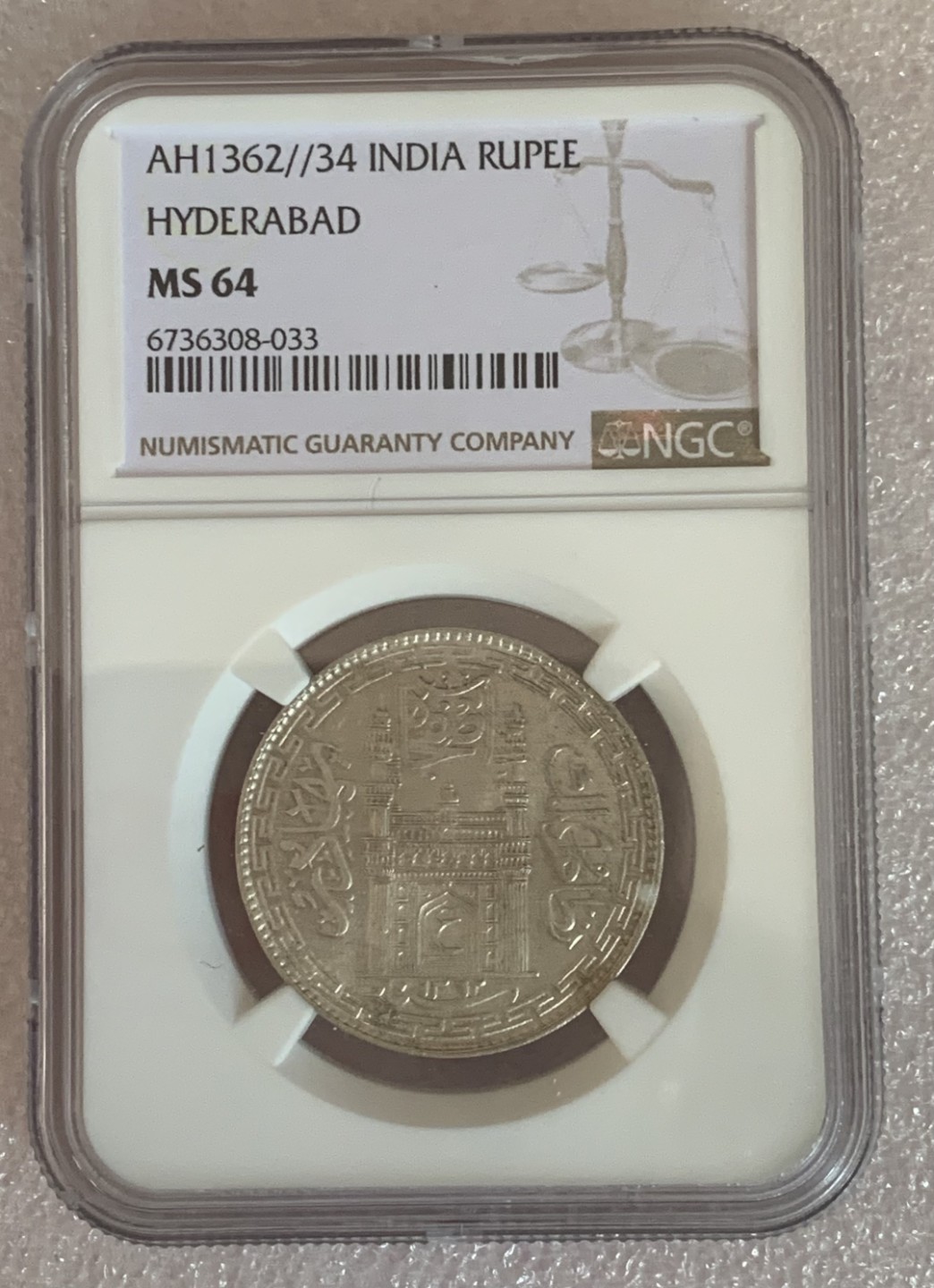 瓶子🏺第89期拍卖会 印度AH1362//34年海得拉巴1卢比银币NGC MS64