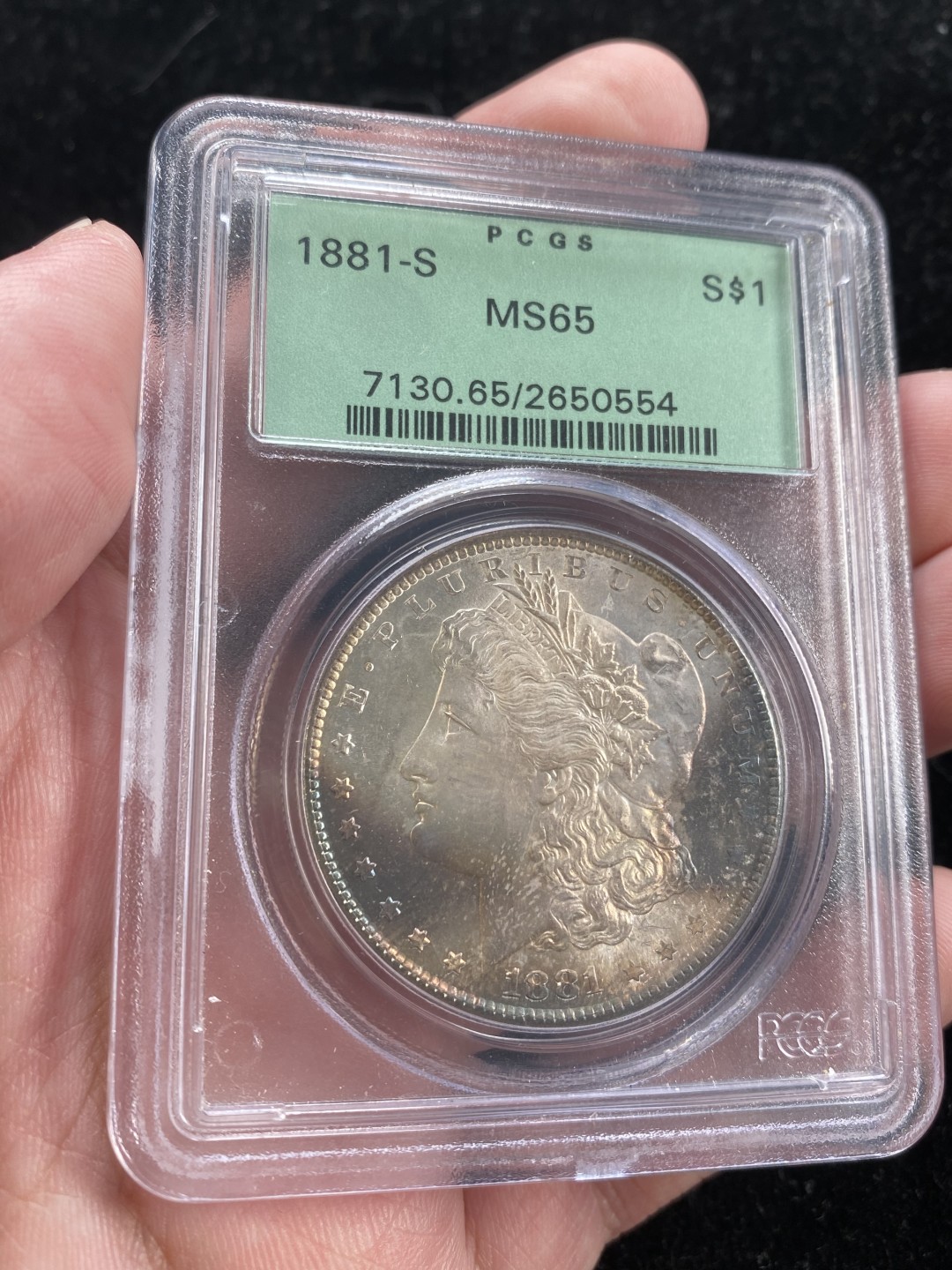 万国钱币拍卖第007期（慕尼黑第二夜） PCGS-MS65 美国1881s摩根1元，PC老绿盒严评，双面月牙彩，整体状态非常舒服。