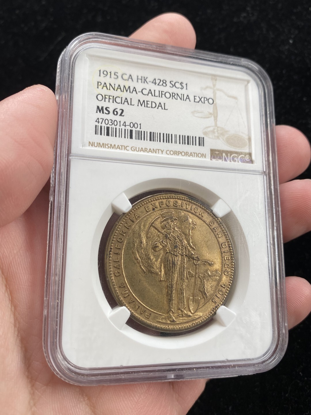 万国钱币拍卖第007期（慕尼黑第二夜） NGC-MS62 美国1915年巴拿马加利福尼亚博览会铜章&代币，面值为1美元，正面是加州淘金工人造型，背面是巴拿马运河开通场景。