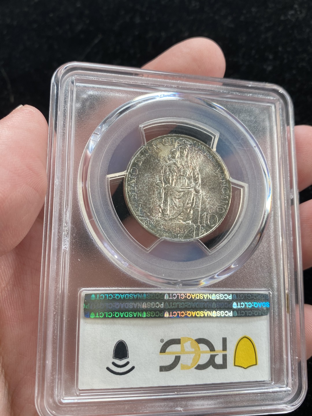 万国钱币拍卖第007期（慕尼黑第二夜） PCGS-MS66 梵蒂冈1936年圣母抱婴10里拉，PCGS亚军分，更高分仅一枚，顶级品相，双面五彩难掩底板光亮。