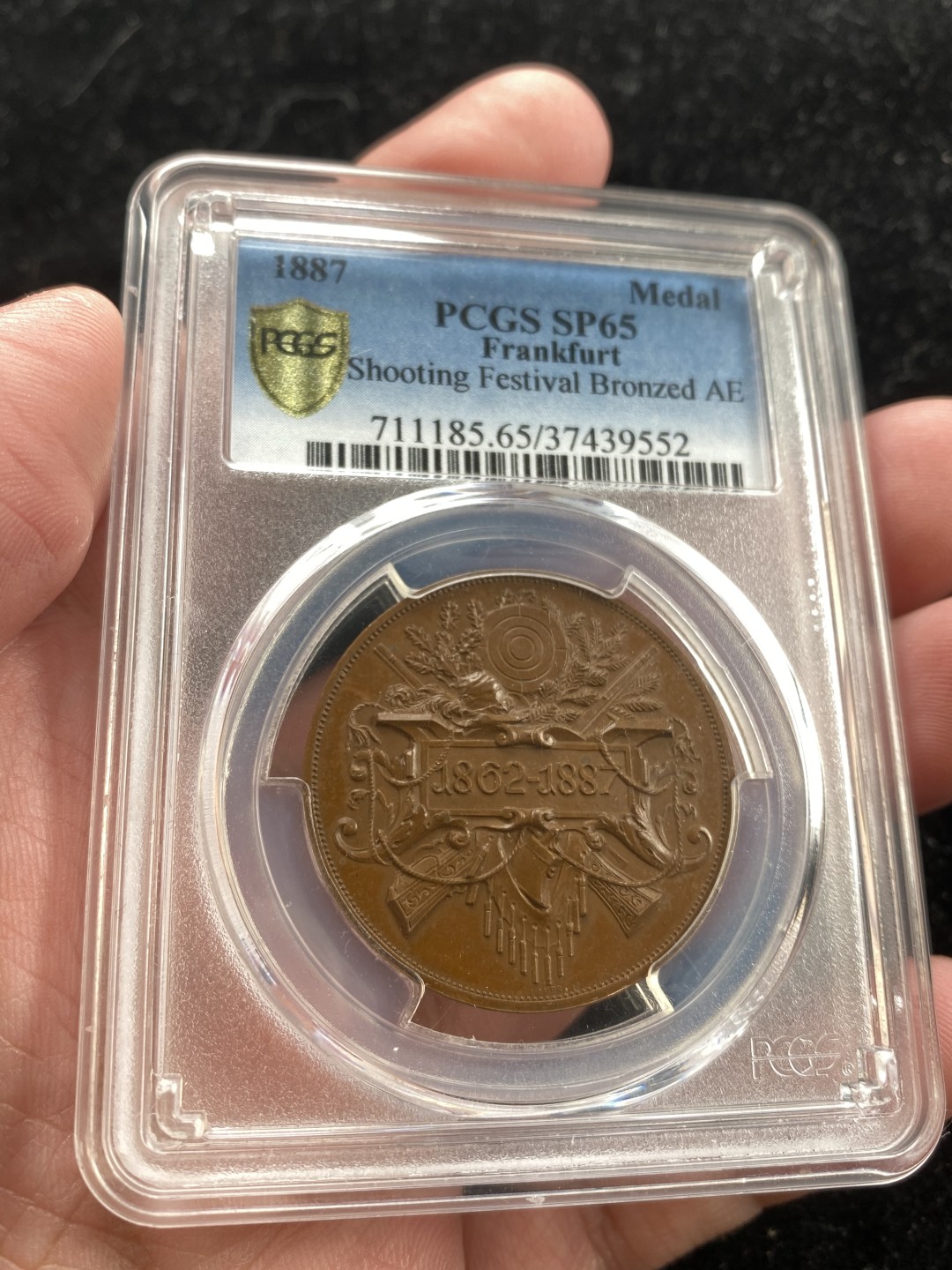 万国钱币拍卖第007期（慕尼黑第二夜） PCGS-SP65 法兰克福1887年射击节铜章，顶级品相，P记唯一冠军分，巧克力包浆，浮雕美丽，德射玩家必备。