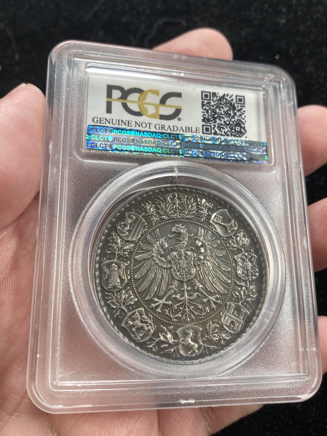 万国钱币拍卖第007期（慕尼黑第二夜） PCGS-UNCD 法兰克福1887年射击节银章带吊环，经典品种，黑色包浆更添韵味，PC加厚盒。