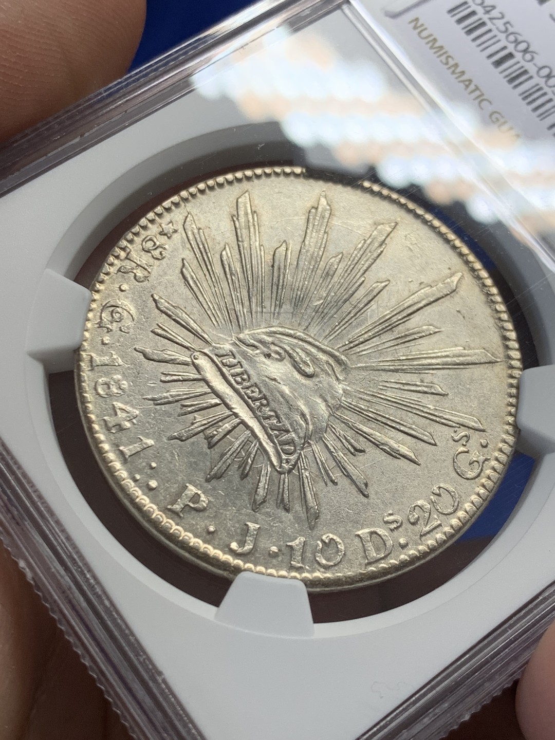 欢迎参加《竞宝斋》五一特拍-第161场-周日，周一 2场 NGC-AU58 墨西哥1841/31年早期骑字版鹰洋 少见骑字版 鹰面透打