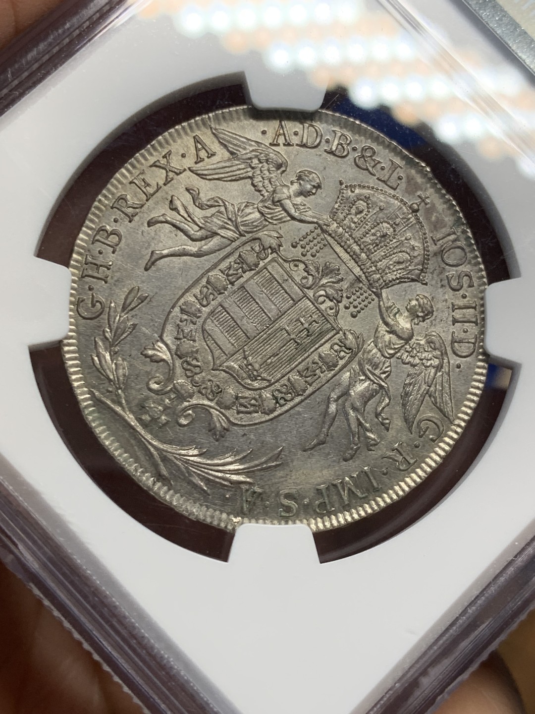 欢迎参加《竞宝斋》五一特拍-第161场-周日，周一 2场 NGC-UNCD 神圣罗马帝国 匈牙利1786年 圣母抱婴1/2泰勒 约瑟夫二世在位时铸造 少见品种，带转光 ngc严评压分了