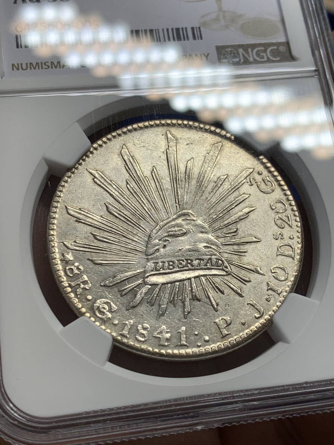 欢迎参加《竞宝斋》五一特拍-第161场-周日，周一 2场 NGC-AU58 墨西哥1841/31年早期骑字版鹰洋 少见骑字版 鹰面透打