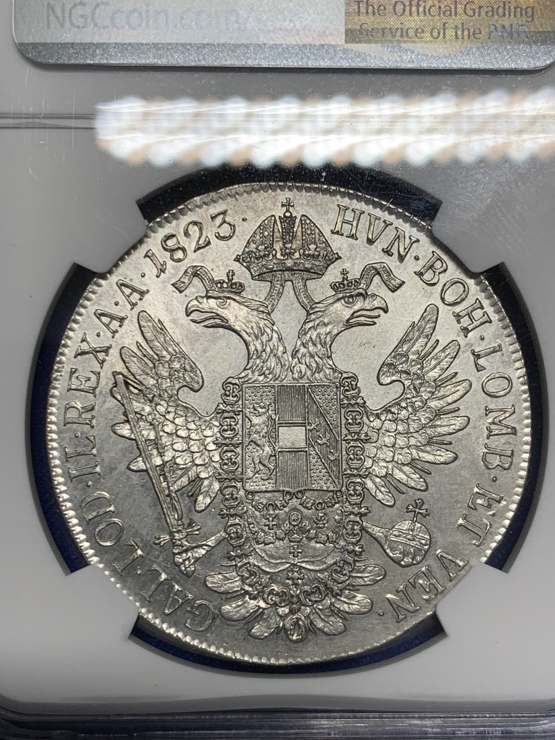 欢迎参加《竞宝斋》五一特拍-第161场-周日，周一 2场 NGC-MS62 奥地利帝国 1823-C 弗朗茨一世泰勒 N/P唯一冠军分 鹰面浮雕细腻 底板完好 收藏级高分