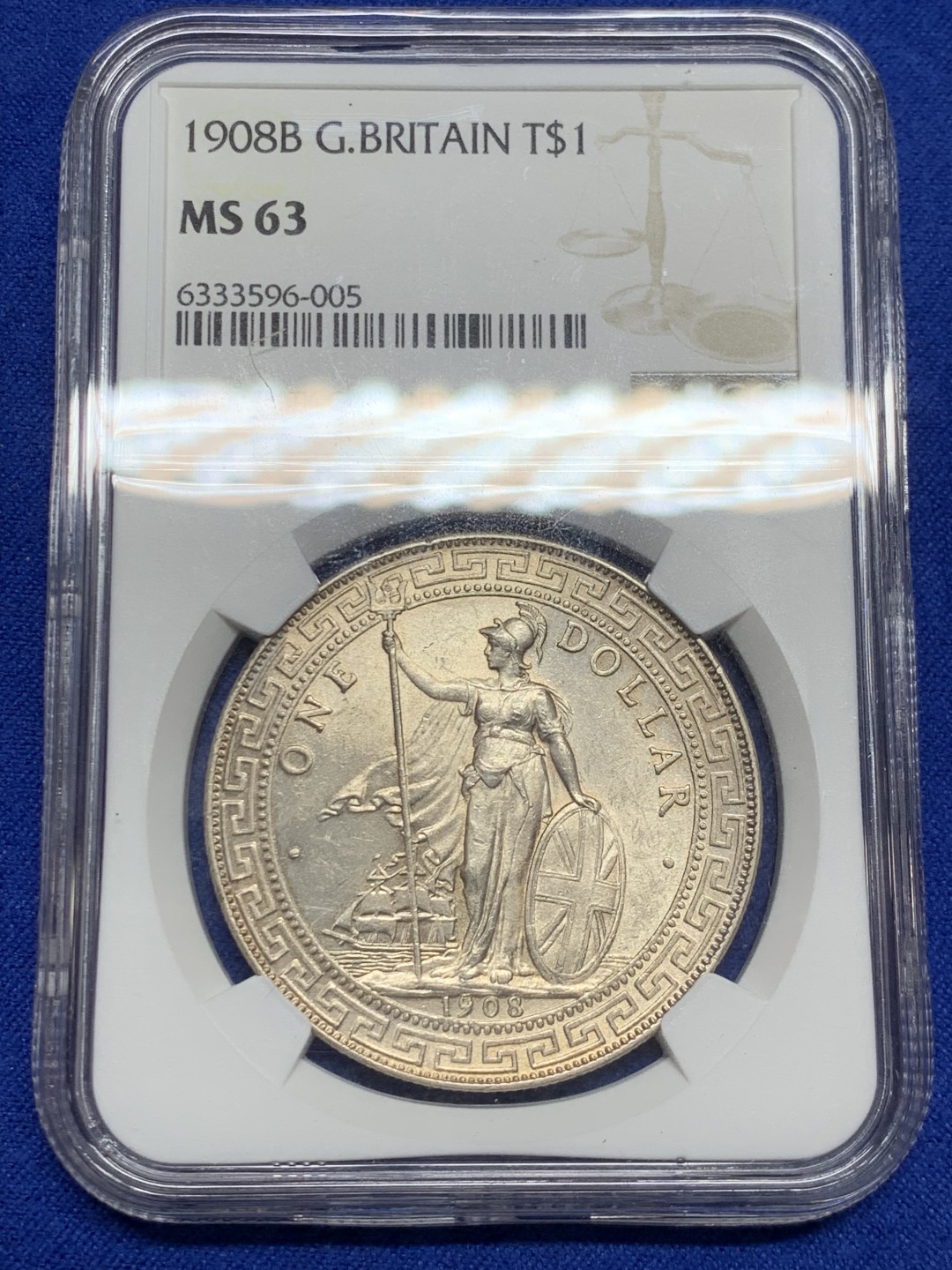 欢迎参加《竞宝斋》五一特拍-第161场-周日，周一 2场 NGC-MS63 英国1908年站洋1元银币，淡淡金色包浆，高点毫无磨损，底板转光级，汉字面观感一流