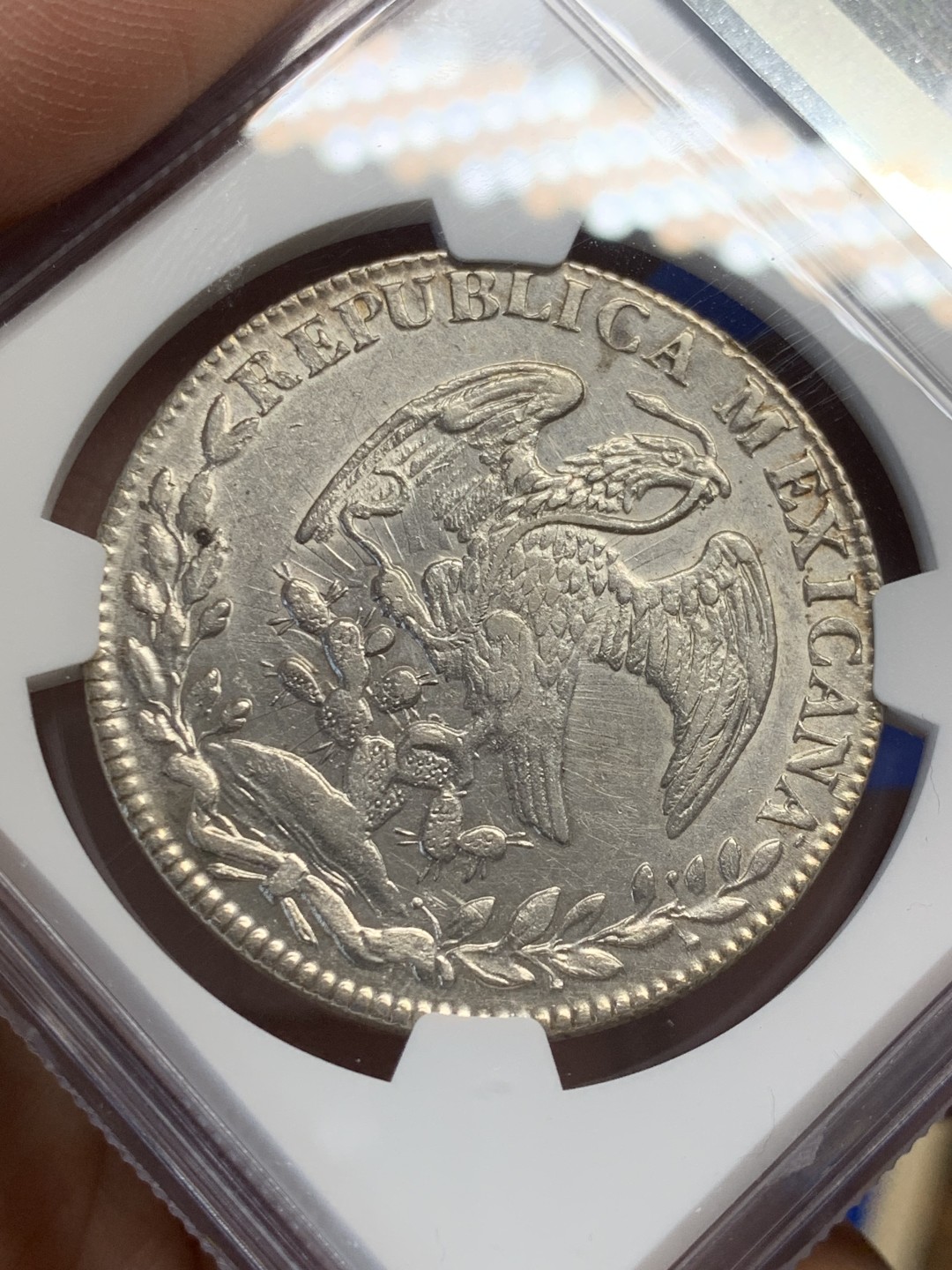 欢迎参加《竞宝斋》五一特拍-第161场-周日，周一 2场 NGC-AU58 墨西哥1841/31年早期骑字版鹰洋 少见骑字版 鹰面透打