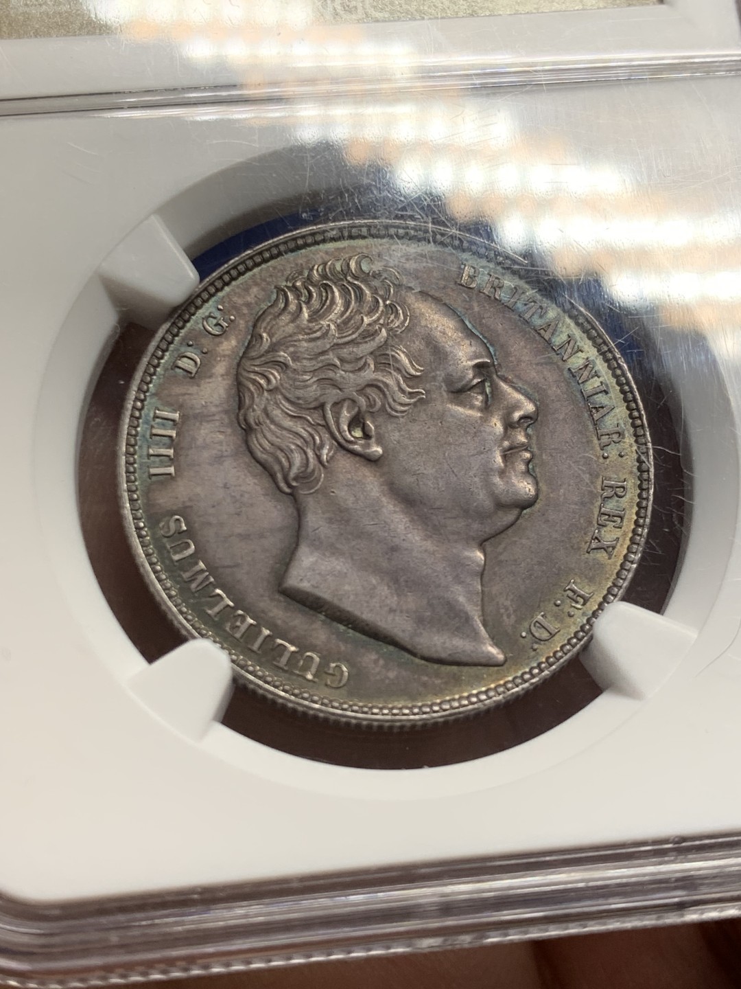 欢迎参加《竞宝斋》五一特拍-第161场-周日，周一 2场 NGC MS63 英国 1834 威廉四世 半克朗银币 极品淡蓝包浆 超级状态