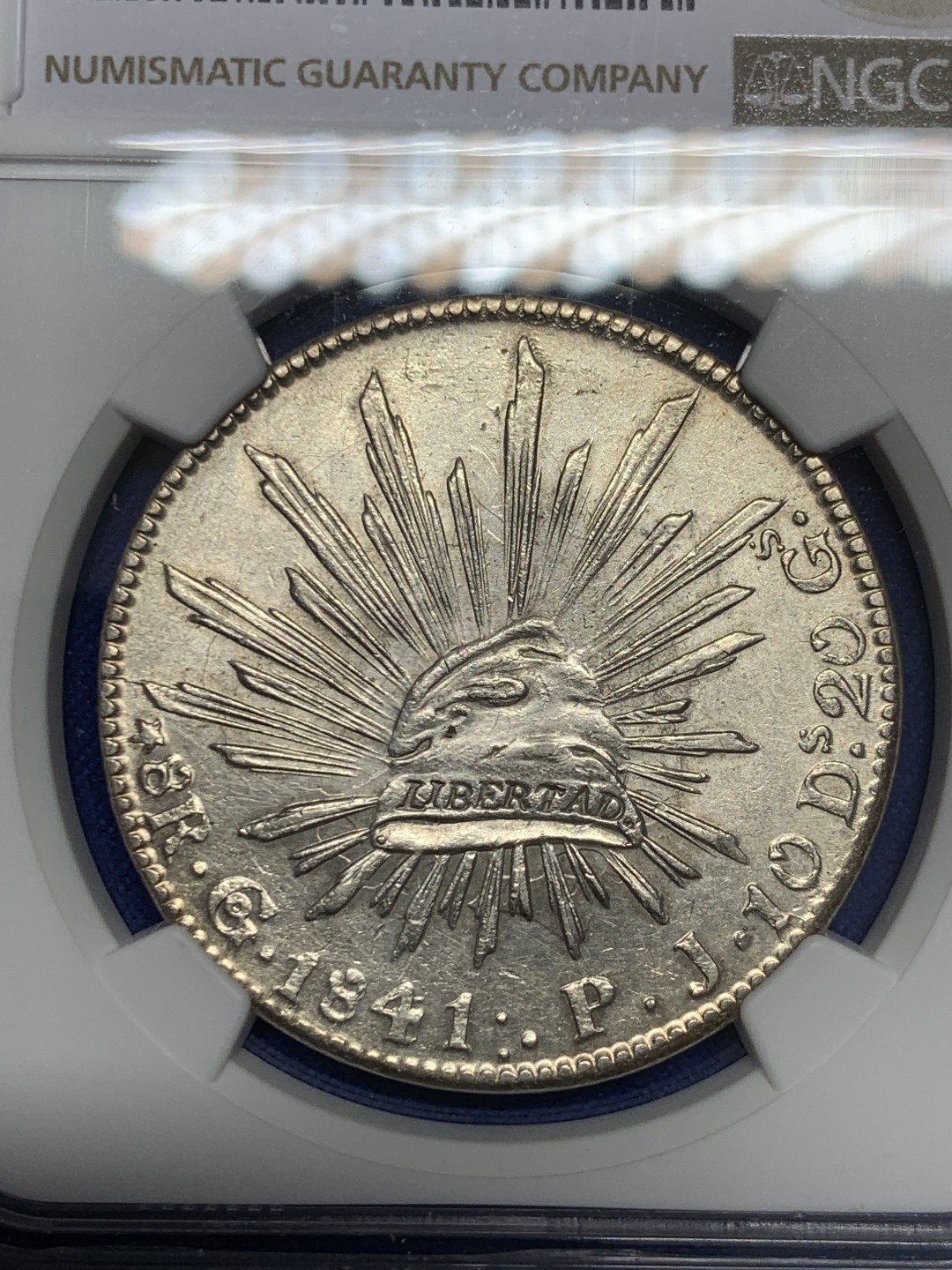 欢迎参加《竞宝斋》五一特拍-第161场-周日，周一 2场 NGC-AU58 墨西哥1841/31年早期骑字版鹰洋 少见骑字版 鹰面透打