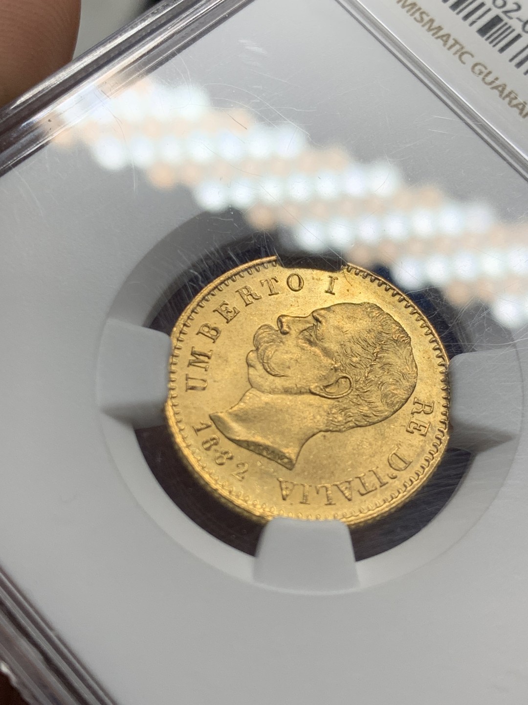 欢迎参加《竞宝斋》五一特拍-第161场-周日，周一 2场 NGC-MS63+ 意大利 1882年 20里拉 翁贝托 金币 6.45克 上涨品种