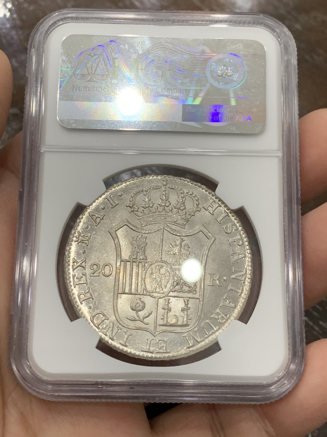 欢迎参加《竞宝斋》五一特拍-第161场-周日，周一 2场 NGC MS62 1810年 法占西班牙 约瑟夫拿破仑20R银币，细节极佳 发丝清晰 光感十足 可以毕业了