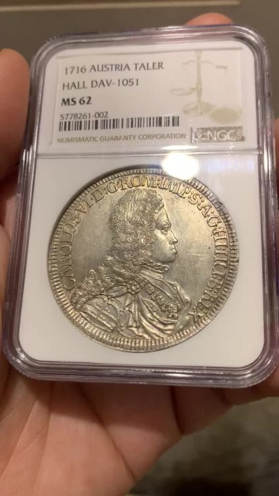 欢迎参加《竞宝斋》五一特拍-第161场-周日，周一 2场 NGC-MS62 神圣罗马帝国 1716年1泰勒银币 卡尔六世少见年轻头像，全币高点和底板没有任何磨损或丝痕，62实属低评