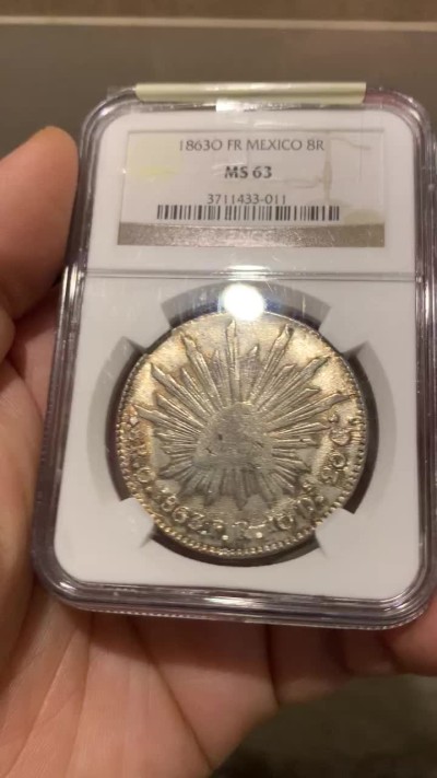 欢迎参加《竞宝斋》五一特拍-第161场-周日，周一 2场 NGC MS63 1863 O FR 墨西哥  早期鹰洋8里亚尔银币，特别粗壮，大名誉品
