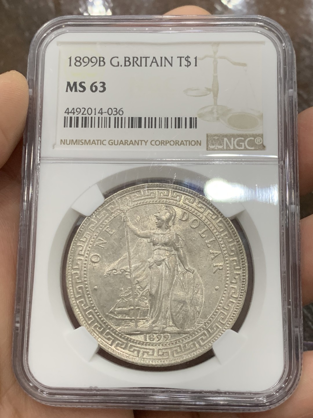 欢迎参加《竞宝斋》五一特拍-第161场-周日，周一 2场 NGC-MS63 英国1899年站洋1元银币，早期年份好品，银霜转光品相